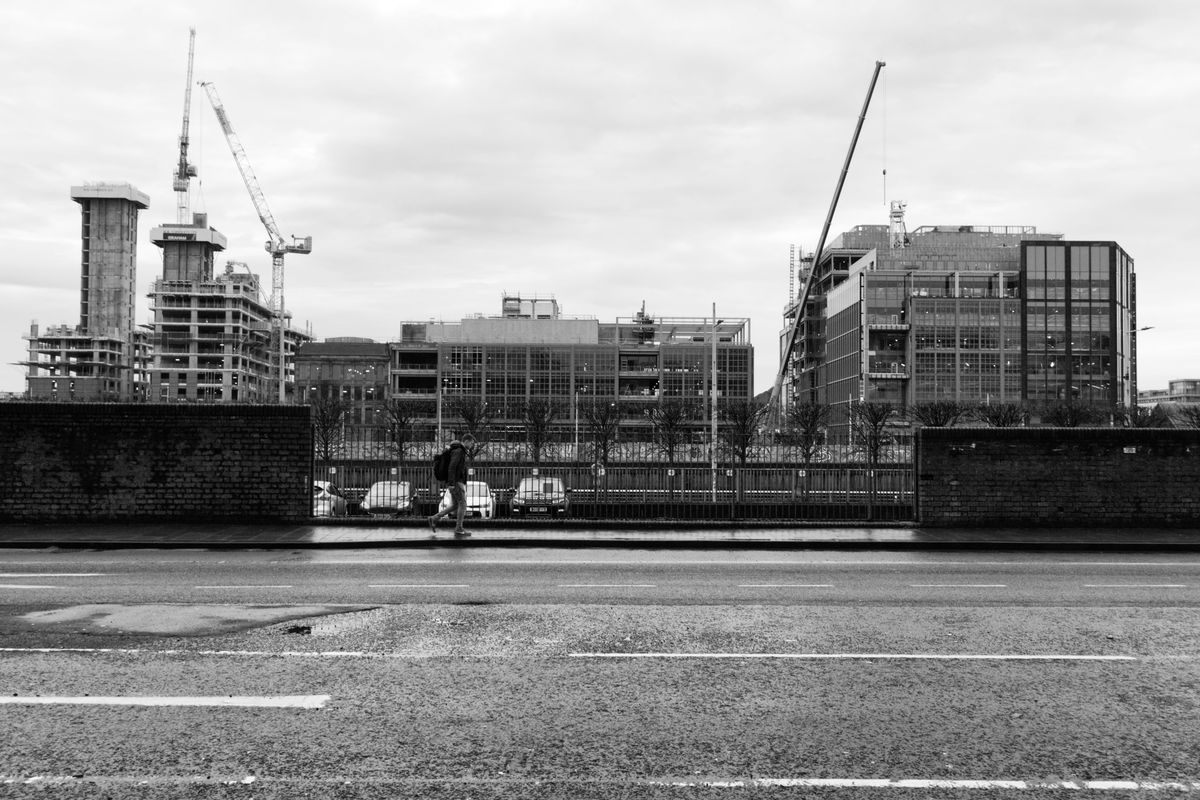 Construction cranes on a building site representing Manchester construction projects accommodation