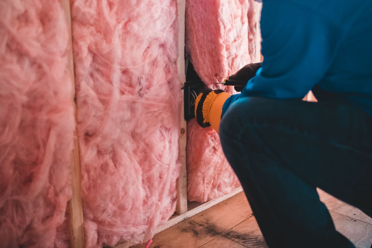 Loft insulation being fitted as part of an EPC C upgrade before 2030