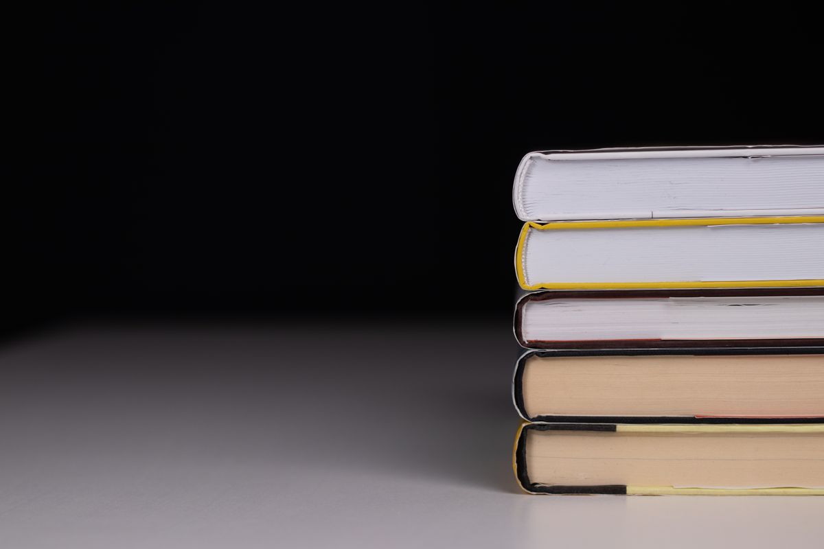 Stack of reference books, representing the guaranteed rent glossary