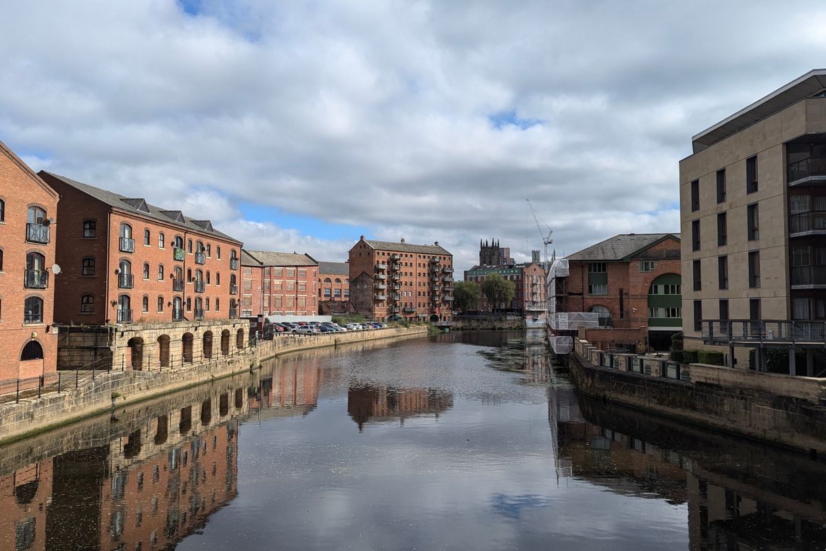 Red brick canal warehouses of a northern English city, home to the guaranteed rent market