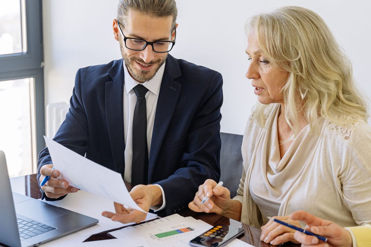 Adviser guiding a client through paperwork for an inherited property in Manchester