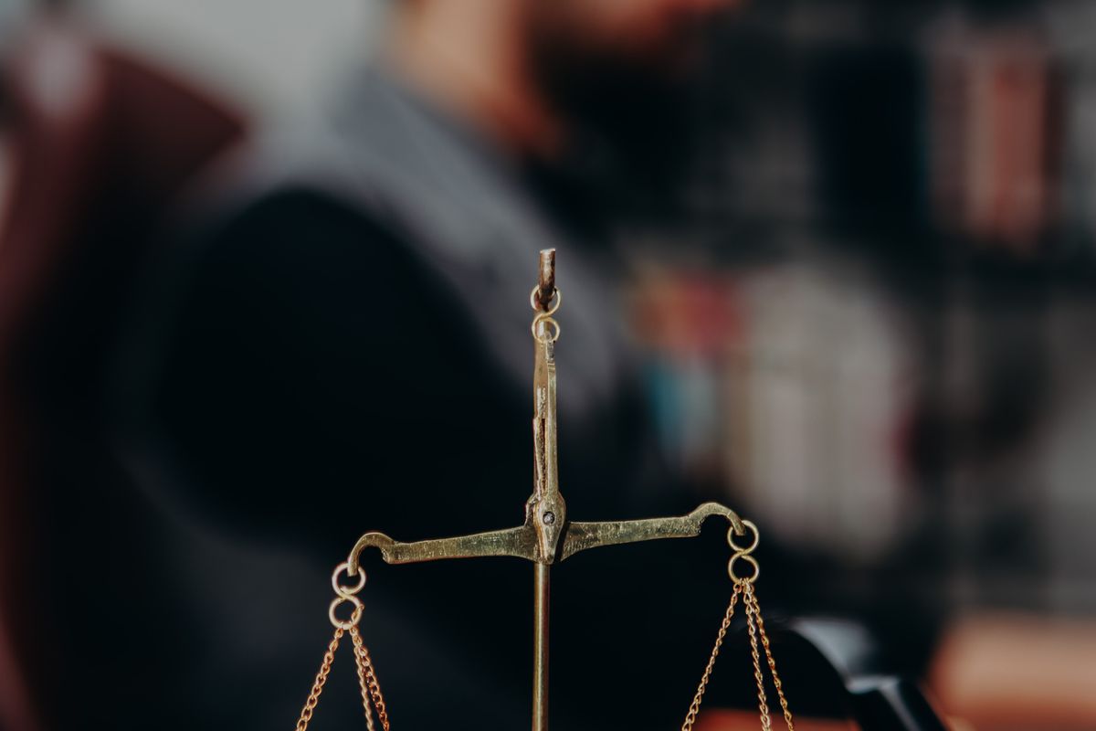Scales of justice and law books covering the grounds for possession in 2026