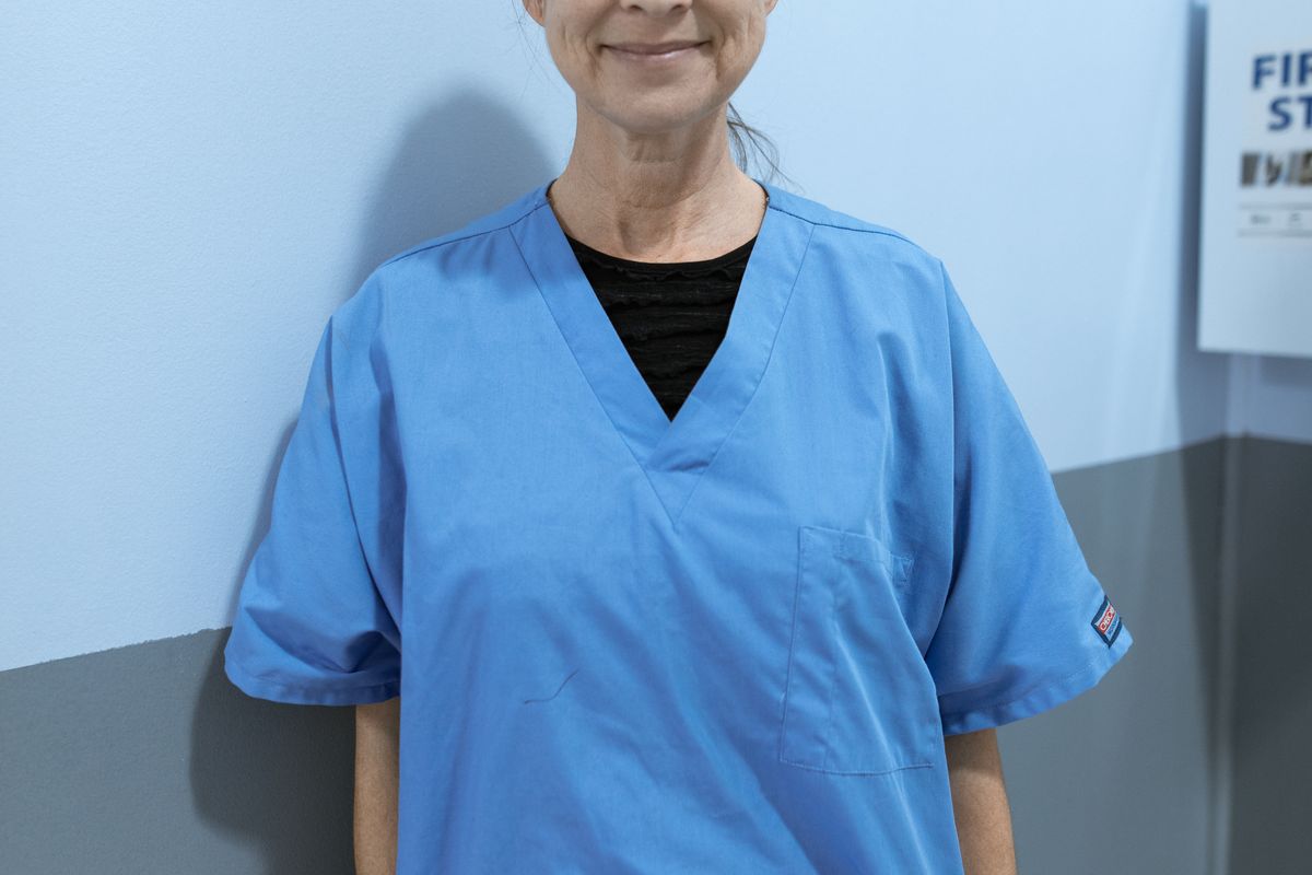 Healthcare worker in scrubs, representing NHS staff accommodation in North Manchester
