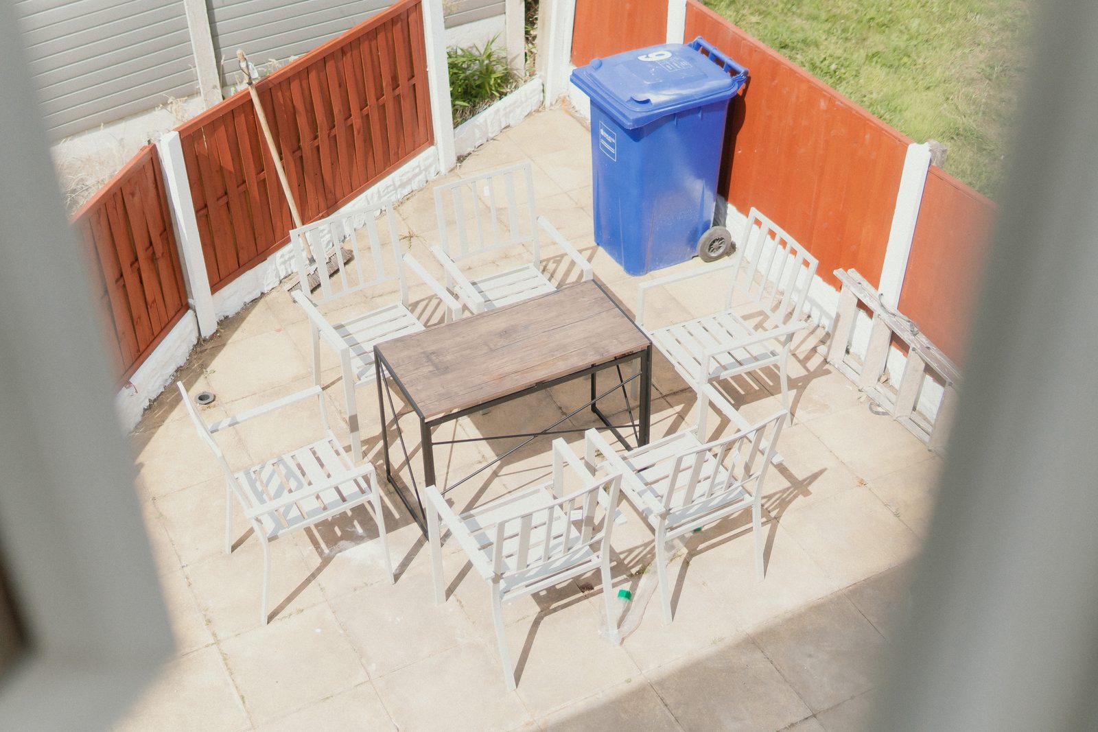 Enclosed patio garden with table and chairs