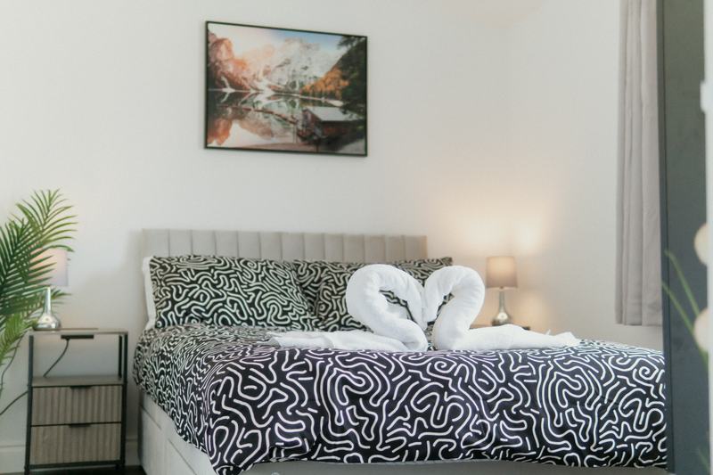 Bedroom 1, made up with fresh white hotel linen