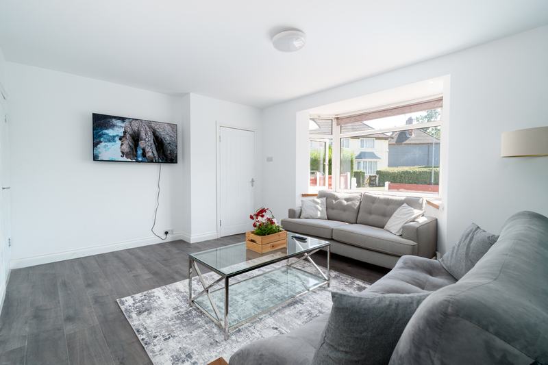 Living room with wall-mounted smart TV